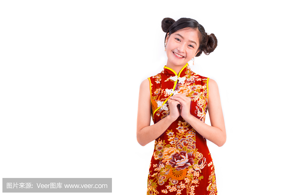 年轻的亚洲美女女人穿着旗袍和祝福或问候姿态
