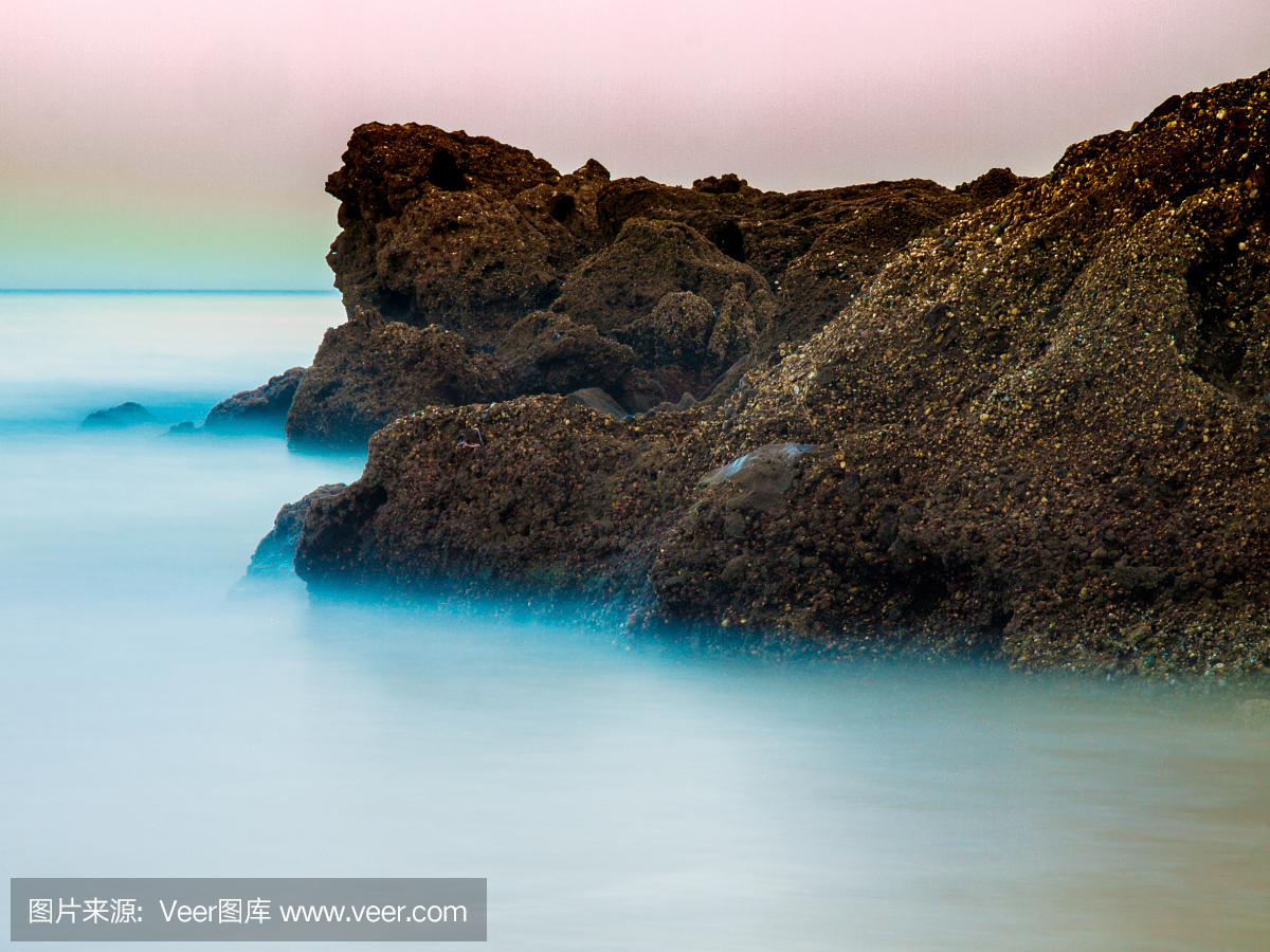 xposure ocean swirling around rocks, Tarifa, Spain
