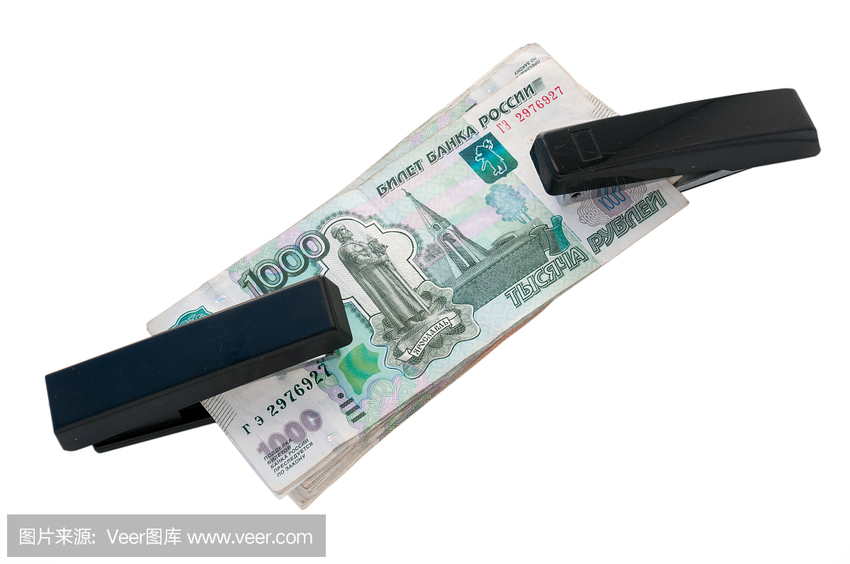 概念黑色订书机拿着钱。两个强化卢布各种线成形品图片