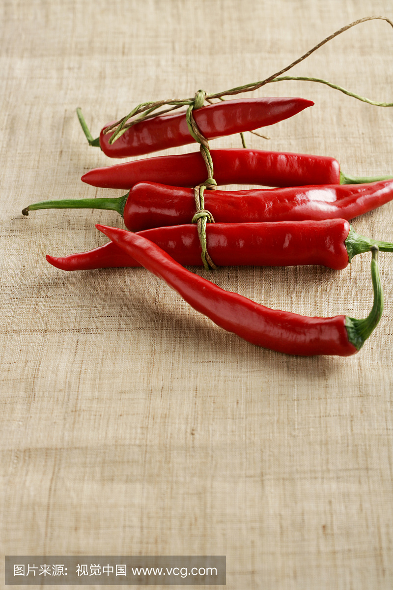 Red pepper bundle with string on textile