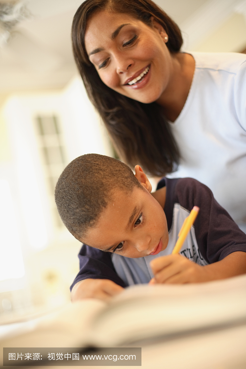 Mother Helping Son with Homework