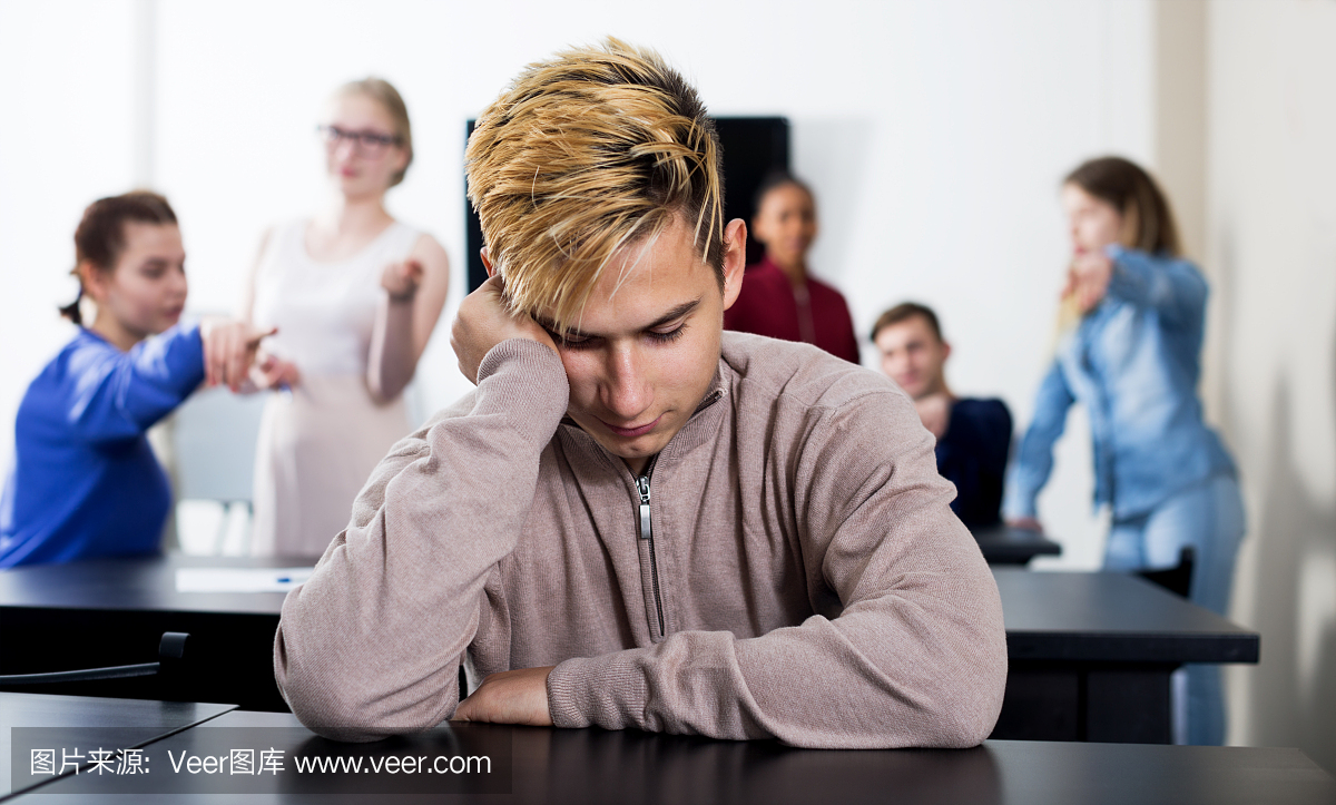 New boy student being shy among classmates