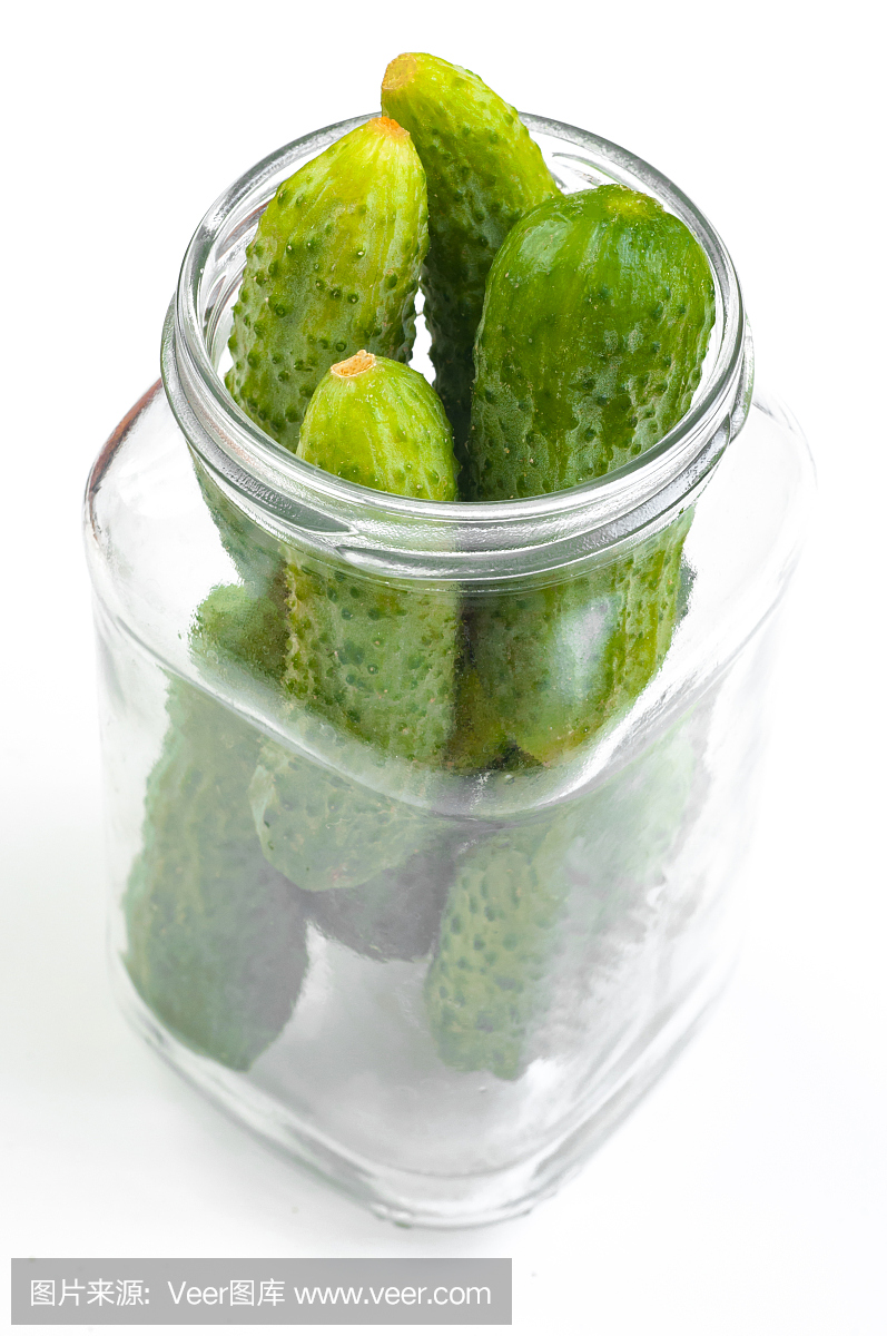 Preservation cucumber in a glass jar isolated o