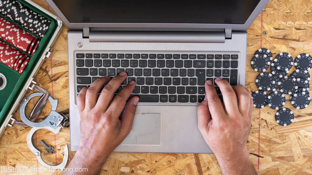 Online poker playing with laptop with wooden b Online poker playing with laptop with wooden b