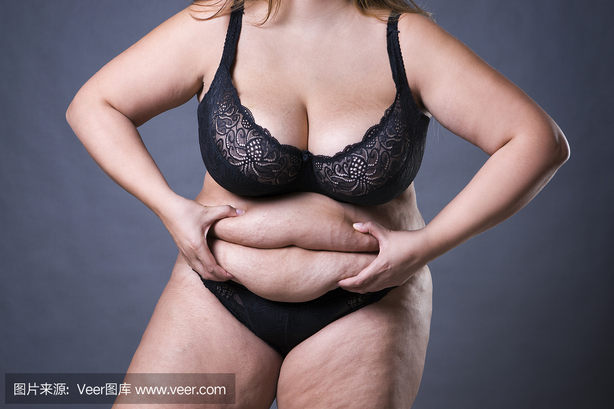 肥胖的腹部的女人,超重的女性的胃,在肚子特写