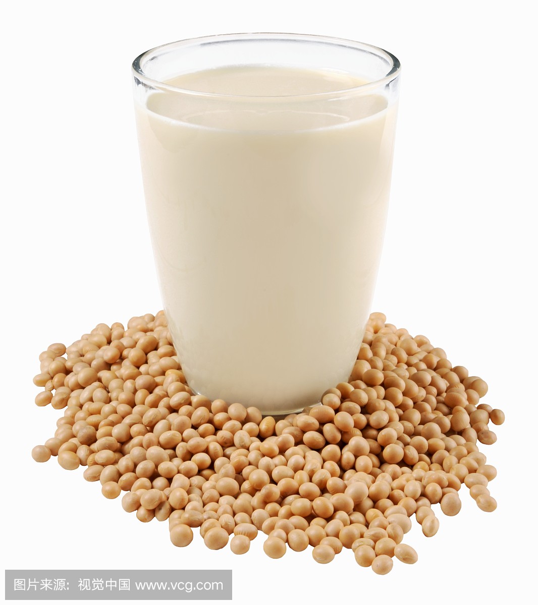 A glass of soya milk on soya beans