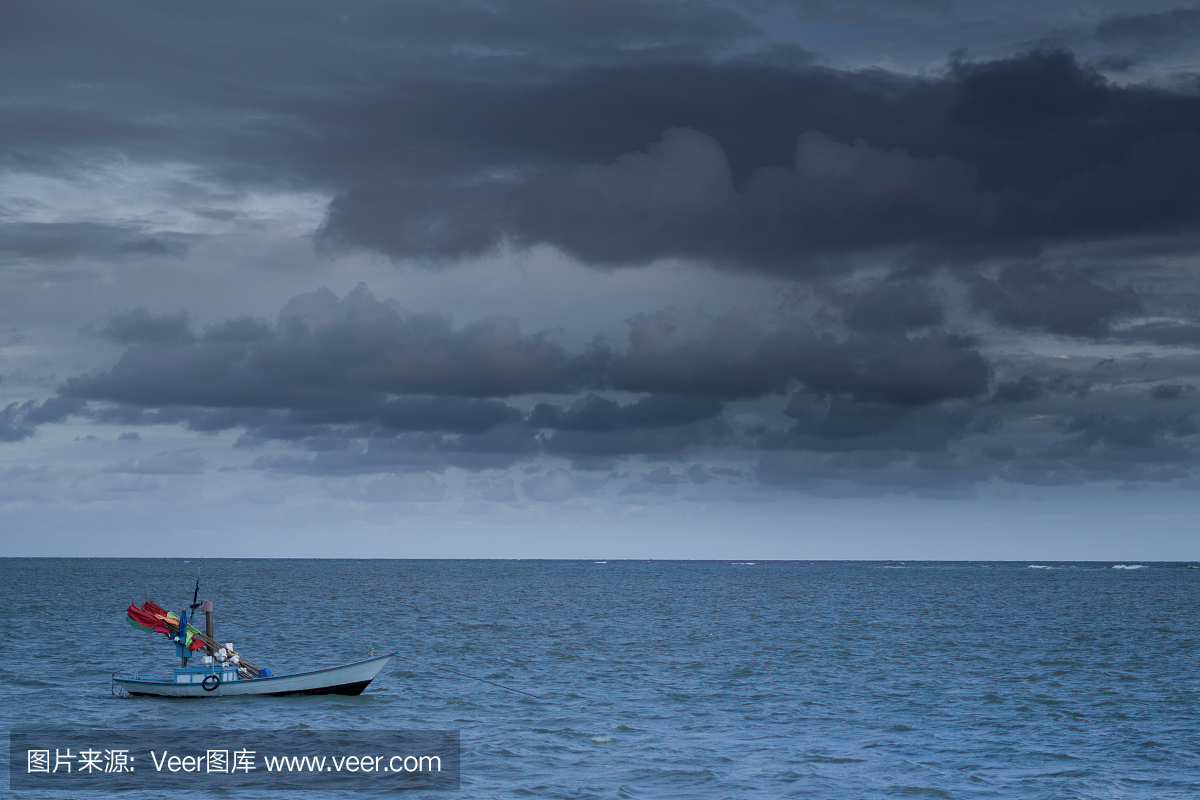 Fishing boats Float on the sea in dark sky and 