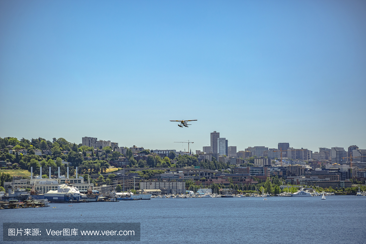 Float plane taking off above the buildings