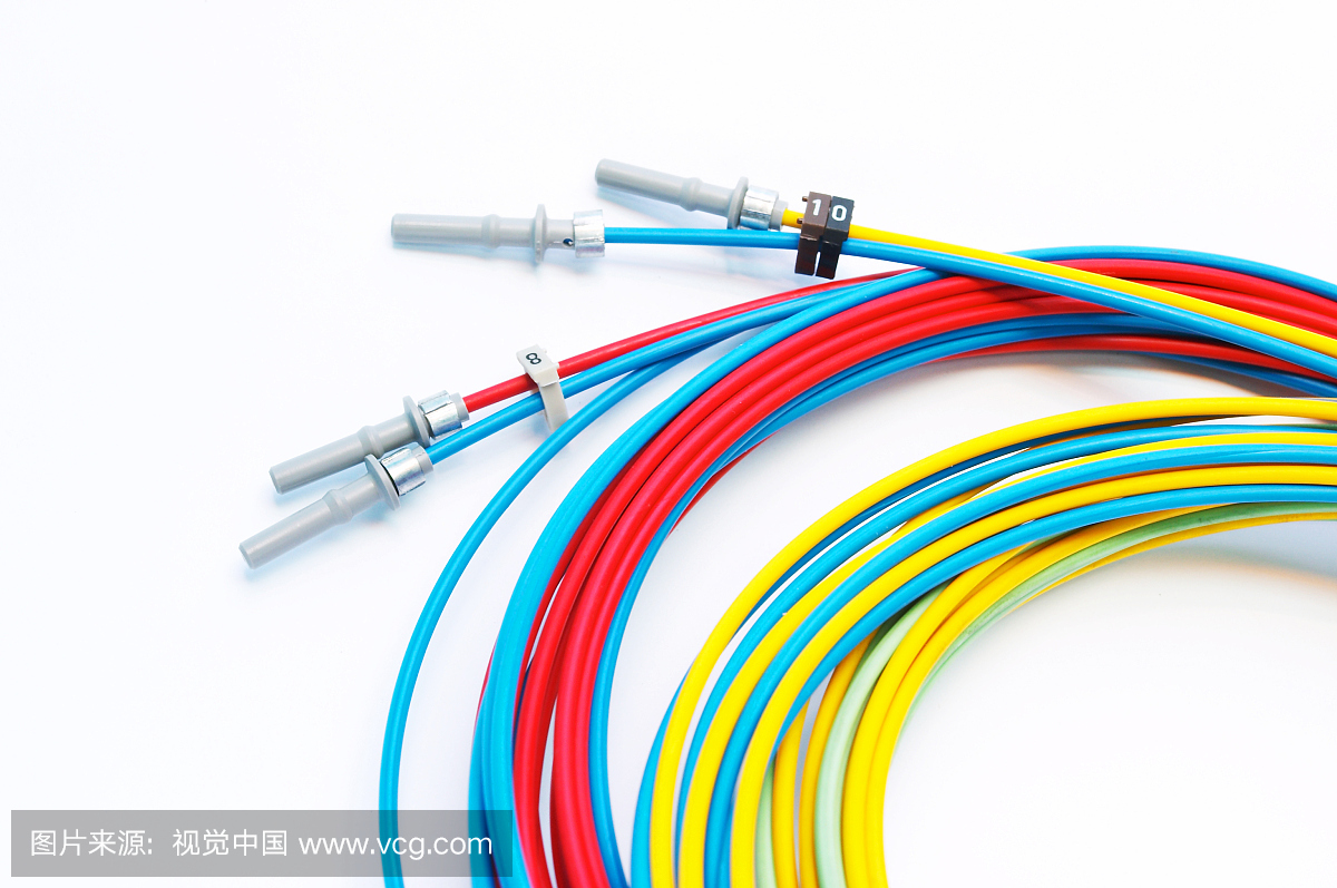 Colorful fiber optic cables against a white back
